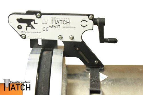 Mechanical flange alignment tool (MFA1T) on an orange pipe, aligned pipe flanges